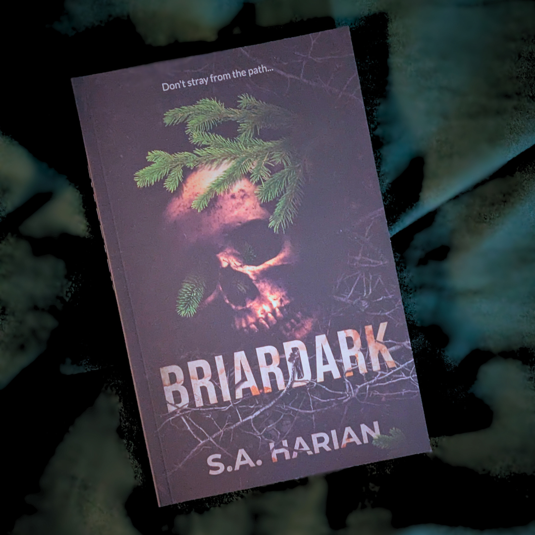 Book titled 'Briardark' by S.A. Harian with a skull and tree design on the cover.